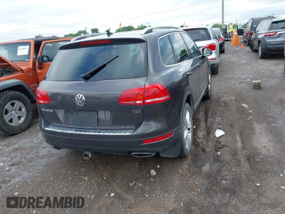 2012 Volkswagen Touareg Sport with VIN WVGFK9BP0CD002939, listed as a IAAI auction lot 42531654 with 222,435 mi miles and . Bid and sale history available at DreamBid. Image 4.