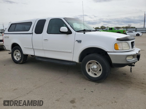 1998 Ford F-150 with VIN 1FTZX18W5WKB91459, listed as a Copart auction lot 52369095 with 185,660 mi miles and Salvage title. Bid and sale history available at DreamBid. Image 4.