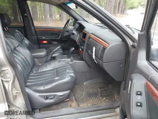 1999 Jeep Grand Cherokee Limited with VIN 1J4GW68N5XC684157, listed as a IAAI auction lot 42104283 with 164,506 mi miles. Bid and sale history available at carsss.com. Image 5.