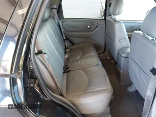 2002 Mazda Tribute LX with VIN 4F2CU08172KM58561, listed as a IAAI auction lot 41435407 with 141,908 mi miles and . Bid and sale history available at carsss.com. Image 8.