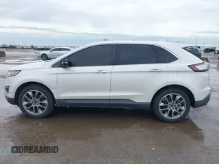 2015 Ford Edge Titanium z VIN 2FMTK3K82FBC42299, wystawiony jako IAAI lot #41912657 z przebiegiem 198 144 mil mil oraz . Historia ofert i sprzedaży dostępna na DreamBid. Obrazek 14.