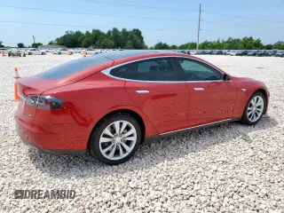 2014 Tesla Model S 60 with VIN 5YJSA1H18EFP38582, listed as a Copart auction lot 56581735 with 69,106 mi miles and Salvage title. Bid and sale history available at DreamBid. Image 3.