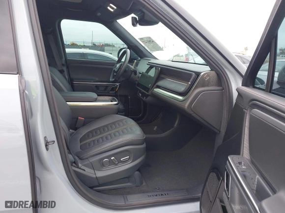 2023 Rivian R1T Launch Edition with VIN 7FCTGAAL3PN017339, listed as a IAAI auction lot 42041423 with 15,098 mi miles. Bid and sale history available at carsss.com. Image 5.