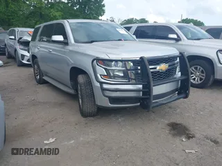 2015 Chevrolet Tahoe Commercial z VIN 1GNLC2EC5FR534173, wystawiony jako IAAI lot #42127196 z przebiegiem 150 568 mil mil oraz . Historia ofert i sprzedaży dostępna na DreamBid. Obrazek 1.