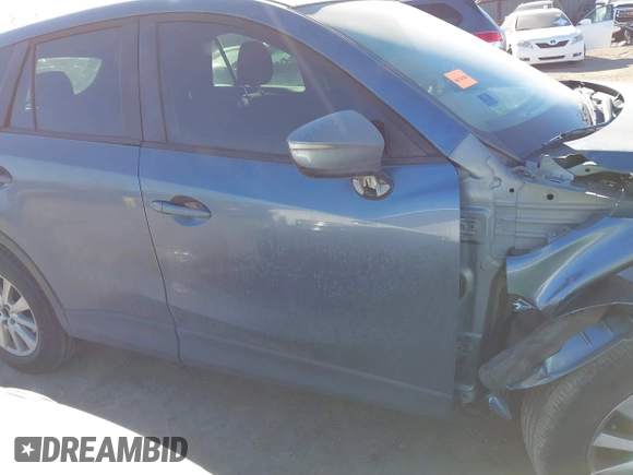 2016 Mazda CX-5 Sport with VIN JM3KE2BY3G0641895, listed as a IAAI auction lot 41689138 with 121,636 mi miles and . Bid and sale history available at DreamBid. Image 14.