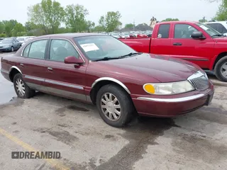 2000 Lincoln Continental with VIN 1LNHM97V5YY845447, listed as a IAAI auction lot 42077417 with 83,655 mi miles. Bid and sale history available at carsss.com. Image 1.