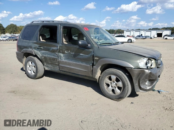 2002 Mazda Tribute LX with VIN 4F2YU09122KM62196, listed as a Copart auction lot 77327034 with 256,385 mi miles and Salvage Title. Bid and sale history available at carsss.com. Image 4.
