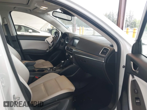 2016 Mazda CX-5 Grand Touring with VIN JM3KE2DYXG0675619, listed as a IAAI auction lot 42137144 with 106,262 mi miles and . Bid and sale history available at DreamBid. Image 5.