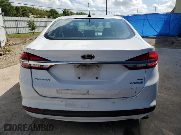 2018 Ford Fusion SE z VIN 3FA6P0LU0JR171651, wystawiony jako Copart lot #58311204 z przebiegiem 124 785 mil mil oraz Czysty tytuł • Clean title. Historia ofert i sprzedaży dostępna na DreamBid. Obrazek 6.