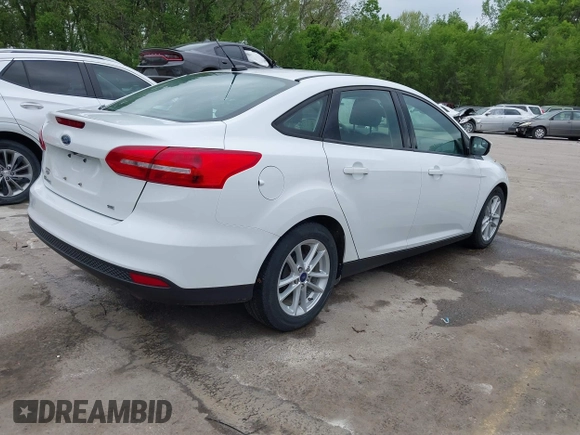 2018 Ford Focus SE with VIN 1FADP3F29JL223389, listed as a IAAI auction lot 42127707 with 87,145 mi miles and . Bid and sale history available at DreamBid. Image 4.