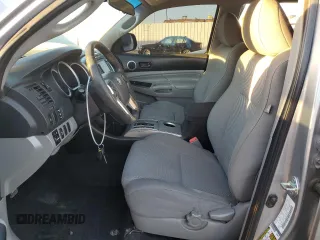 2014 Toyota Tacoma PreRunner with VIN 3TMKU4HNXEM041311, listed as a Copart auction lot 84065684 with 212,473 mi miles and Salvage title. Bid and sale history available at DreamBid. Image 7.