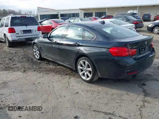 2016 BMW 4 Series 428i xDrive with VIN WBA4C9C52GG136584, listed as a IAAI auction lot 41530110 with 124,667 mi miles and . Bid and sale history available at carsss.com. Image 3.
