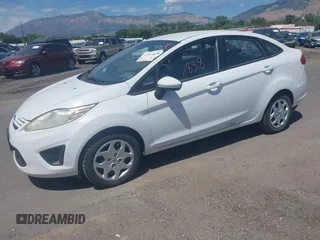 2013 Ford Fiesta S z VIN 3FADP4AJ6DM114105, wystawiony jako IAAI lot #42411838 z przebiegiem 497 236 mil mil oraz . Historia ofert i sprzedaży dostępna na DreamBid. Obrazek 2.