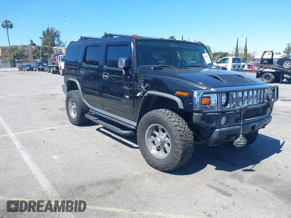 2003 Hummer H2 z VIN 5GRGN23U63H117676, wystawiony jako IAAI lot #41816411 z przebiegiem Nie podano mil oraz . Historia ofert i sprzedaży dostępna na DreamBid. Obrazek 1.