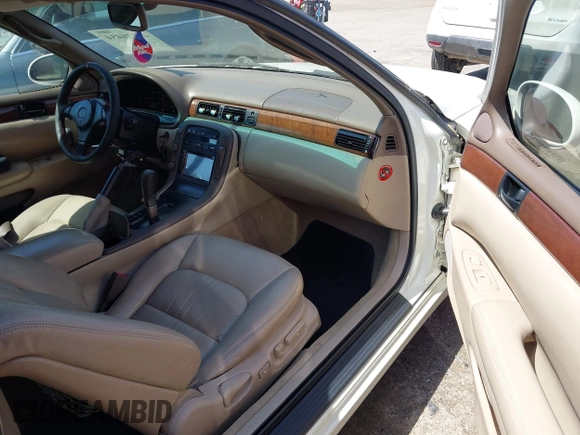 1997 Lexus SC 300 with VIN JT8CD32Z2V0039032, listed as a IAAI auction lot 42556454 with 164,629 mi miles and . Bid and sale history available at DreamBid. Image 5.