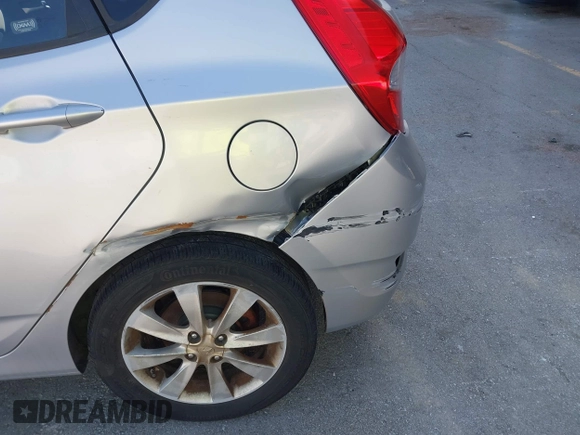 2012 Hyundai Accent SE with VIN KMHCU5AE0CU021092, listed as a IAAI auction lot 41789027 with 137,557 mi miles. Bid and sale history available at carsss.com. Image 6.