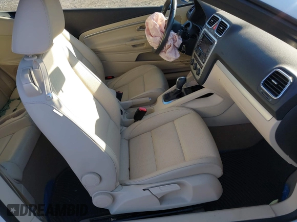 2015 Volkswagen Eos Komfort with VIN WVWBW8AH0FV001011, listed as a IAAI auction lot 41297299 with 81,444 mi miles and . Bid and sale history available at DreamBid. Image 5.