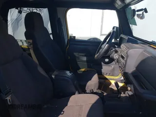 2005 Jeep Wrangler X with VIN 1J4FA39S25P374373, listed as a IAAI auction lot 41754017 with 195,156 mi miles. Bid and sale history available at carsss.com. Image 5.