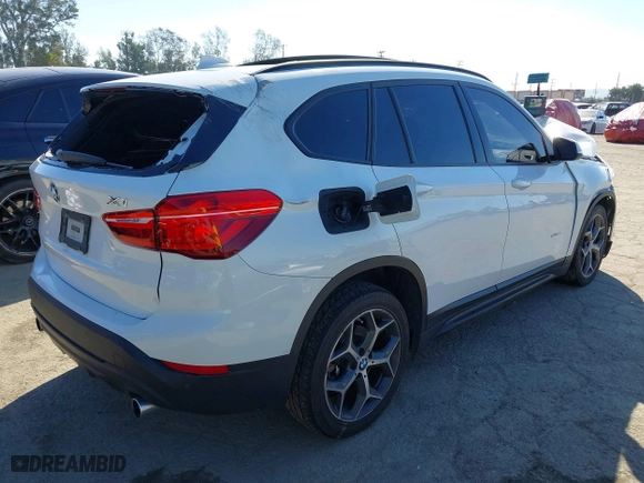 2016 BMW X1 xDrive28i with VIN WBXHT3C32G5E51855, listed as a IAAI auction lot 41634237 with 69,101 mi miles. Bid and sale history available at carsss.com. Image 4.