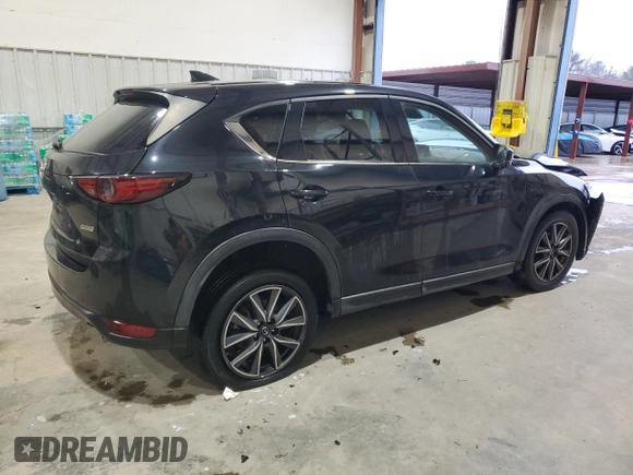 2018 Mazda CX-5 Grand Touring with VIN JM3KFADM3J0325843, listed as a Copart auction lot 87958375 with 93,577 mi miles and Salvage title. Bid and sale history available at DreamBid. Image 3.