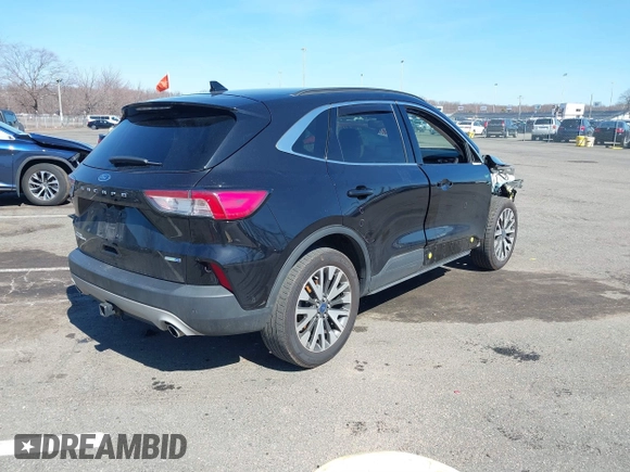 2020 Ford Escape Titanium z VIN 1FMCU9J98LUA44923, wystawiony jako IAAI lot #41779691 z przebiegiem 73 259 mil mil oraz . Historia ofert i sprzedaży dostępna na DreamBid. Obrazek 4.