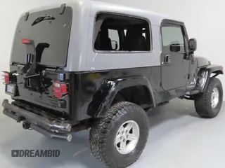 2005 Jeep Wrangler Unlimited with VIN 1J4FA44S75P305935, listed as a Copart auction lot 52035455 with 116,569 mi miles and Salvage Title. Bid and sale history available at carsss.com. Image 4.
