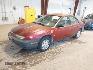 1996 Saturn SL with VIN 1G8ZG528XTZ192914, listed as a IAAI auction lot 41604499 with 126,180 mi miles. Bid and sale history available at carsss.com. Image 2.