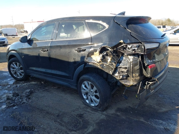 2019 Hyundai Tucson Value with VIN KM8J33A4XKU979791, listed as a IAAI auction lot 41255630 with 90,807 mi miles. Bid and sale history available at carsss.com. Image 3.