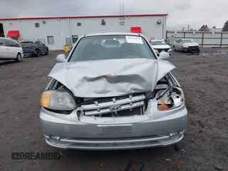 2005 Hyundai Accent GLS with VIN KMHCG35C25U359293, listed as a IAAI auction lot 41233474 with 148,344 mi miles. Bid and sale history available at carsss.com. Image 12.