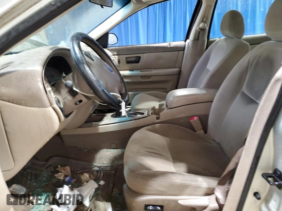 2003 Ford Taurus SE Standard z VIN 1FAFP532X3A195612, wystawiony jako Copart lot #54016645 z przebiegiem 143 168 mil mil oraz Szkoda całkowita • Salvage title. Historia ofert i sprzedaży dostępna na DreamBid. Obrazek 7.