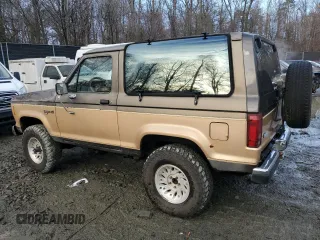 1988 Ford Bronco с VIN 1FMCU14T6JUA71950, выставлен на аукционе Copart как лот 85363734 с пробегом 47 657 миль миль и Чистый • Clean title. История ставок и продаж доступна на DreamBid. Изображение 2.