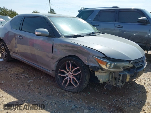 2014 Scion tC with VIN JTKJF5C78E3075164, listed as a IAAI auction lot 41922609 with 142,064 mi miles. Bid and sale history available at carsss.com. Image 1.