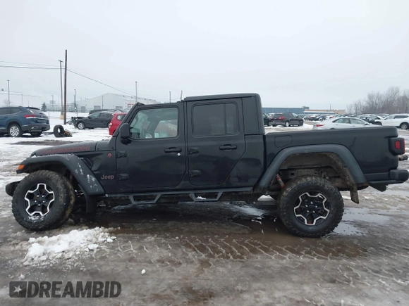 2021 Jeep Gladiator Rubicon z VIN 1C6JJTBG5ML605799, wystawiony jako IAAI lot #41190679 z przebiegiem 47 550 mil mil oraz . Historia ofert i sprzedaży dostępna na DreamBid. Obrazek 14.