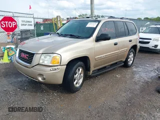 2005 GMC Envoy SLT with VIN 1GKDS13S452141376, listed as a IAAI auction lot 42095025 with 198,911 mi miles and . Bid and sale history available at DreamBid. Image 2.