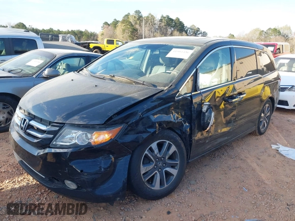 2014 Honda Odyssey Touring with VIN 5FNRL5H90EB077054, listed as a IAAI auction lot 41904456 with 197,869 mi miles and . Bid and sale history available at carsss.com. Image 2.