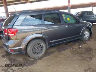 2019 Dodge Journey SE z VIN 3C4PDCBG9KT798938, wystawiony jako IAAI lot #42174970 z przebiegiem Nie podano mil oraz . Historia ofert i sprzedaży dostępna na DreamBid. Obrazek 4.