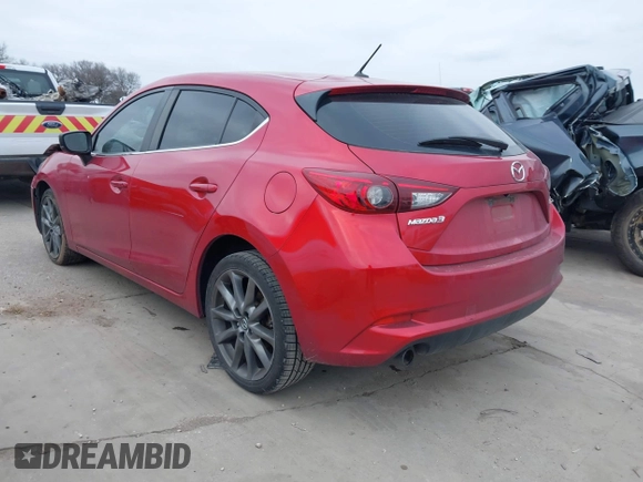 2018 Mazda 3 Touring with VIN 3MZBN1L37JM167604, listed as a IAAI auction lot 41623232 with 118,974 mi miles. Bid and sale history available at carsss.com. Image 3.