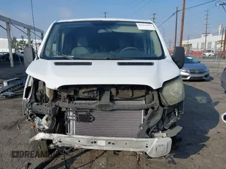 2015 Ford Transit Cargo with VIN 1FTYR1ZM7FKB05121, listed as a IAAI auction lot 41461900 with 190,821 mi miles and . Bid and sale history available at DreamBid. Image 12.