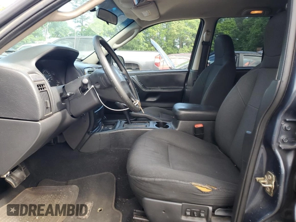 2004 Jeep Grand Cherokee Laredo with VIN 1J4GX48S24C216941, listed as a Copart auction lot 55584785 with 279,710 mi miles and Salvage title. Bid and sale history available at DreamBid. Image 7.