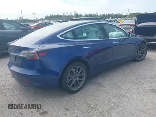 2020 Tesla Model 3 Standard Range Plus with VIN 5YJ3E1EA7LF785838, listed as a IAAI auction lot 41586081 with 38,392 mi miles and . Bid and sale history available at carsss.com. Image 4.