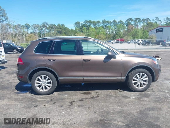 2014 Volkswagen Touareg Sport with VIN WVGEF9BP7ED003525, listed as a IAAI auction lot 41868307 with 74,379 mi miles and . Bid and sale history available at DreamBid. Image 13.