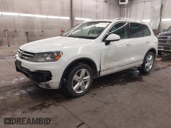 2013 Volkswagen Touareg Lux with VIN WVGEF9BP5DD011511, listed as a IAAI auction lot 41608840 with 167,350 mi miles and . Bid and sale history available at DreamBid. Image 2.