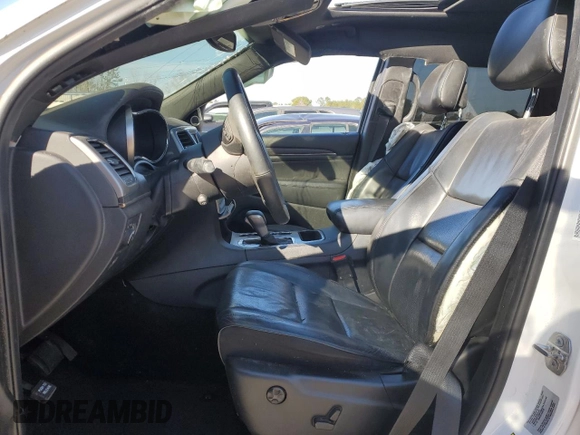 2018 Jeep Grand Cherokee High Altitude with VIN 1C4RJECG1JC125602, listed as a Copart auction lot 88702275 with 59,701 mi miles and Salvage title. Bid and sale history available at DreamBid. Image 7.