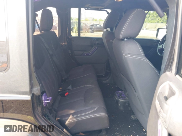 2014 Jeep Wrangler Unlimited Sahara with VIN 1C4BJWEG6EL217945, listed as a IAAI auction lot 42388477 with 61,739 mi miles and . Bid and sale history available at DreamBid. Image 8.