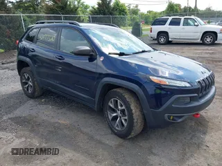 2014 Jeep Cherokee Trailhawk with VIN 1C4PJMBS4EW281449, listed as a IAAI auction lot 42477320 with 128,107 mi miles and . Bid and sale history available at DreamBid. Image 1.