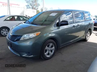 2014 Toyota Sienna L with VIN 5TDZK3DC6ES441417, listed as a IAAI auction lot 41950033 with 170,804 mi miles. Bid and sale history available at carsss.com. Image 2.
