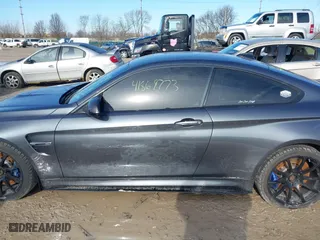 2015 BMW M4 with VIN WBS3R9C57FK334921, listed as a IAAI auction lot 41869773 with 107,058 mi miles. Bid and sale history available at carsss.com. Image 14.