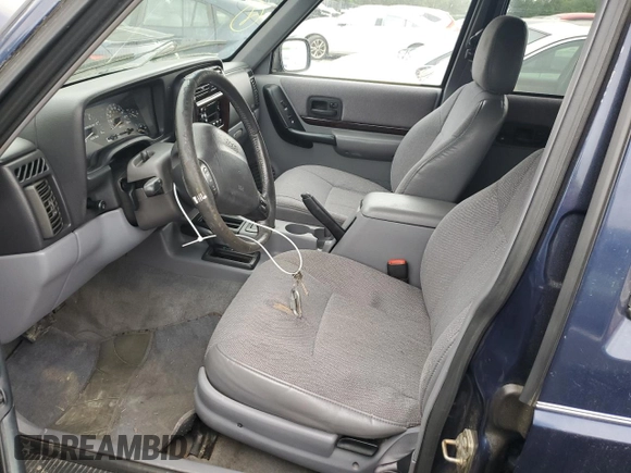 1997 Jeep Cherokee Country with VIN 1J4FJ78S4VL589852, listed as a Copart auction lot 56294015 with 189,530 mi miles and Salvage title. Bid and sale history available at DreamBid. Image 7.