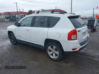 2011 Jeep Compass Latitude with VIN 1J4NT1FB1BD192076, listed as a IAAI auction lot 42121930 with 148,548 mi miles. Bid and sale history available at carsss.com. Image 3.