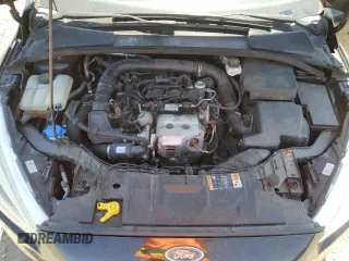 2018 Ford Focus SE z VIN 1FADP3FE0JL293485, wystawiony jako Copart lot #61202625 z przebiegiem 91 025 mil mil oraz Szkoda całkowita • Salvage title. Historia ofert i sprzedaży dostępna na DreamBid. Obrazek 11.